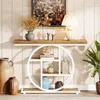 A console table with decorative items displayed on it and around it, set against a wood-paneled wall. Anteprima dell’immagine prodotto