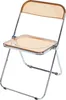 A transparent orange folding chair with a silver metal frame, shown against a white background. Produktbild-Vorschau