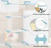 A three-tier drying rack with laundry in the background. Voir les images du produit