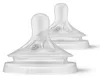 Two clear baby bottle nipples with a white base, shown against a white background. Produktbild-Vorschau
