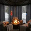Cozy outdoor seating area with a fire pit in a snowy environment, protected by thick curtains. Náhled obrázku produktu
