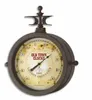 A vintage-style thermometer with a clock face, mounted on a white background. Anteprima dell’immagine prodotto