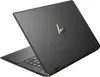 The back of a dark gray HP Spectre x360 convertible laptop is shown at an angle against a white background. Produktbild-Vorschau