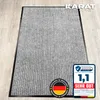 A gray doormat with vertical stripes is shown on a wooden floor. There are marketing overlays and logos on the image. Náhled obrázku produktu