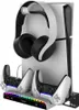 A white and black gaming accessory stand holding headphones and two controllers, with a colorful LED light strip at the base. Produktbild-Vorschau