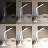 A collage of six images showing a white LED desk lamp with a digital display, demonstrating different lighting levels and color temperatures. Anteprima dell’immagine prodotto