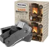 A product shot of Rekord Kamin Briketts with two boxes stacked and several briquettes in the foreground. Produktbild-Vorschau