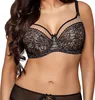A woman wearing a black lace bra and matching underwear. Produktbild-Vorschau