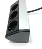 A close-up, angled view of a silver and black power strip with three outlets, set against a white background. Produktbild-Vorschau
