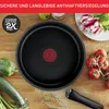 A frying pan is shown on a wooden surface surrounded by fresh vegetables. Produktbild-Vorschau