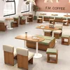 A modern cafe interior with various seating arrangements and tables. Produktbild-Vorschau
