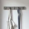 A wall-mounted coat rack with two items hanging on it. Náhľad obrázku produktu