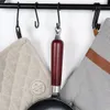 Close-up of kitchen items hanging on a rack. Produktbild-Vorschau