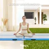 A woman meditating on an airtrack mat indoors and outdoors. Náhled obrázku produktu