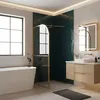 A modern bathroom with a bathtub, shower, and vanity. Náhled obrázku produktu