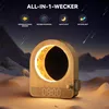 A wooden alarm clock with a moon-shaped light display, set in a desert landscape with mountains in the background and shooting stars in the sky. Produktbild-Vorschau