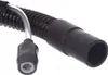 A close-up view of a black corrugated hose with a silver metal insert and a gray connector attached. Náhľad obrázku produktu