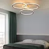 A bedroom with a modern ceiling light fixture above a bed. Podgląd zdjęcia produktu