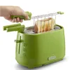 A hand is using a green toaster to toast bread. The toaster is lime green and has a chrome finish on the top. The bread is golden brown and is being held up by a metal rack. Podgląd zdjęcia produktu