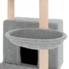 A close-up view of a grey cat tree with sisal scratching posts and a basket. Náhľad obrázku produktu