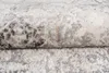 A close-up, folded view of a textured rug with a distressed pattern. Anteprima dell’immagine prodotto