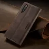 A brown leather flip case for a smartphone is displayed on a textured brown background. Produktbild-Vorschau