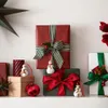 Christmas gifts and decorations arranged on a shelf. Podgląd zdjęcia produktu