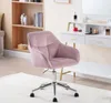 A pink velvet office chair is shown in a room with a bookshelf and a vanity table. Produktbild-Vorschau