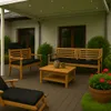 An outdoor patio set with wooden furniture and black cushions, set under a pergola with lights. Produktbild-Vorschau