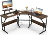 An L-shaped desk with a monitor, laptop, and decorative items. Anteprima dell’immagine prodotto