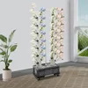 A vertical garden system with artificial flowers on a patio. Podgląd zdjęcia produktu