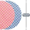 Two round fabric coasters with a gingham pattern, one red and white, the other blue and white, are shown overlapping. A ruler-like graphic with text indicating size is on the right. Produktbild-Vorschau