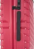Close-up view of the side of a pink suitcase, showing the handle and TSA lock. Náhľad obrázku produktu
