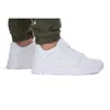 A person wearing white Puma sneakers and green cargo pants. Produktbild-Vorschau