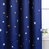 A close-up view of a blue curtain with a star pattern, partially covering a window. Produktbild-Vorschau