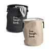 Two laundry baskets with text on them, one black and one natural colored. Podgląd zdjęcia produktu