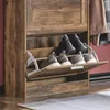A close-up shot of a wooden shoe cabinet with several pairs of shoes stored inside. Náhled obrázku produktu