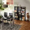 Dining room setting with a table, chairs, and a bookshelf. Náhled obrázku produktu