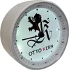 A close-up, angled view of a white Otto Kern alarm clock with a illuminated face and a black lion logo. Produktbild-Vorschau