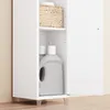 A close-up view of a white cabinet with its door open, revealing cleaning supplies and a basket on shelves. Náhled obrázku produktu