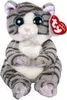 A stuffed cat toy with large blue eyes and gray stripes, sitting upright. A red TY tag is attached to its ear. Produktbild-Vorschau