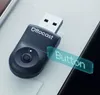 A close-up shot of a black Ottocast USB adapter with a holographic overlay indicating 'Button'. Produktbild-Vorschau