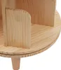 Close-up of a wooden shelf unit with multiple compartments and a round base supported by a leg. Náhled obrázku produktu
