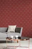 A living room scene with a sofa, coffee table, and wallpaper. Produktbild-Vorschau