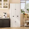 A white kitchen cabinet with two drawers and four doors is shown in a kitchen setting next to a coffee maker. Podgląd zdjęcia produktu