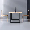 A dining table with two chairs and a vase of flowers. Podgląd zdjęcia produktu