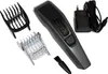A hair clipper and its accessories are laid out on a white background. Anteprima dell’immagine prodotto