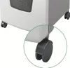 A close-up view of the wheels of a white and gray office shredder. Voir les images du produit