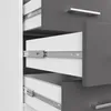 A close-up view of the inside of a cabinet or desk, showing multiple drawers with metal drawer slides. Produktbild-Vorschau