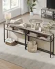 A living room scene with a sofa, coffee table, and console tables. Produktbild-Vorschau